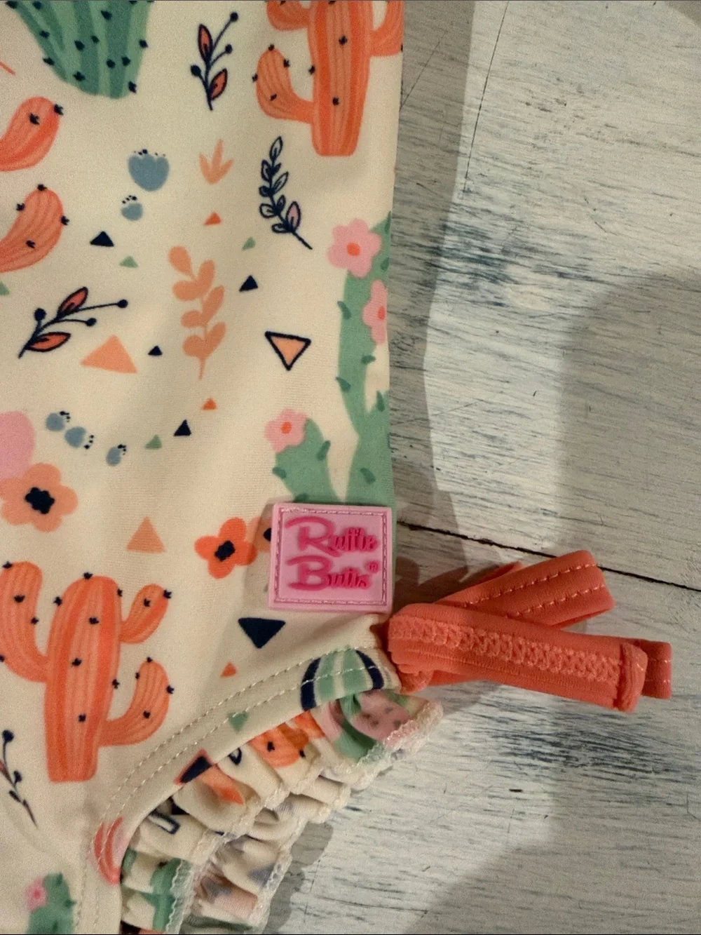 Ruffle Butts Cream Cactus-Print Long-Sleeve One-Piece with Coral Trim size 0-3mo